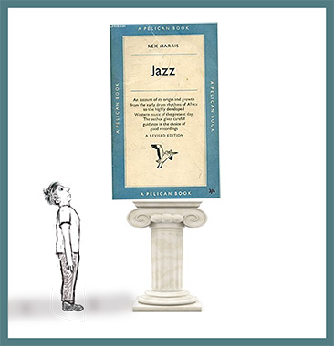 boy looking up at book on Jazz by Rex Harris which is on a pedestal