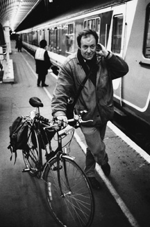 Miles getting onto train with his bike